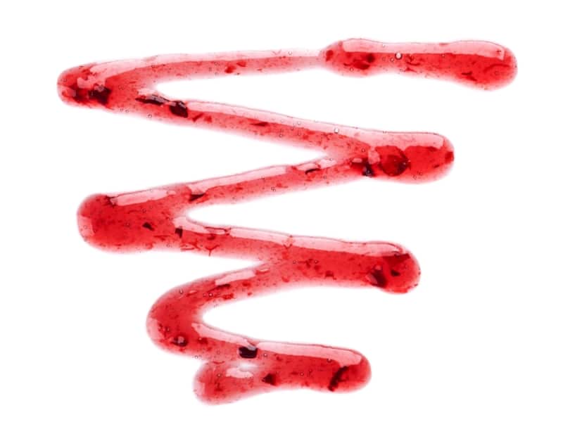 cherry-jam-drizzle-isolated-white-background